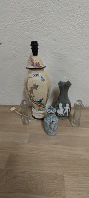 three vases sitting on a wooden table next to each other