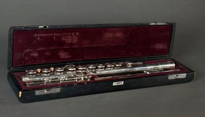 a flute that is in a case on a table