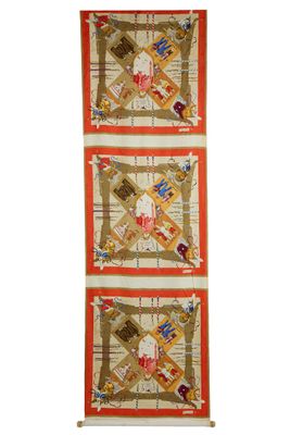 a close up of a wall hanging on a white wall