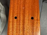 a piece of wood with holes in it on a table