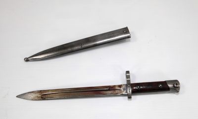 two different types of knives on a white surface
