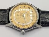 a close up of a wrist watch on a white surface