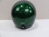 a green helmet sitting on a white table