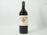 a bottle of wine that is sitting on a table