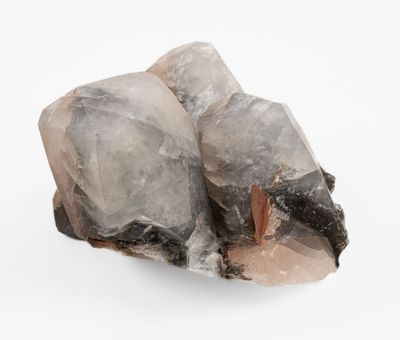 a close up of a rock on a white surface