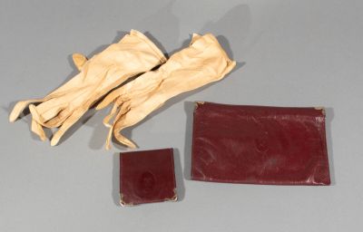a pair of gloves and a wallet on a table