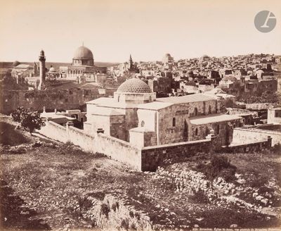 an old photo of a view of a city from the top of a hill