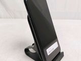 a cell phone that is sitting on a stand