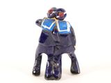 a figurine of an elephant with a hat on it ' s head