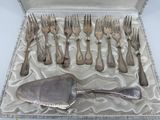 silverware in a silver box with a spoon and fork in it