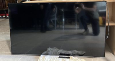 a tv that is sitting on the floor in the room