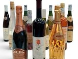 many bottles of wine that are lined up in a row