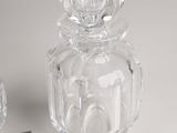 a glass jar with a black lid and a small glass jar with a black lid