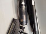 a black cordless hair dryer and a black cordless hair dryer on a table