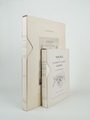 two books sitting next to each other on a white surface