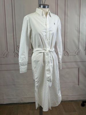 a picture of a white shirt dress on a mannequin stand