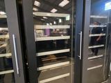 two glass doors that are open in a store