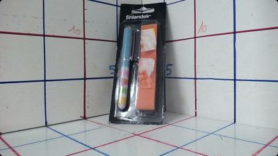 a toothbrush and a toothpaste in the corner of a bathroom