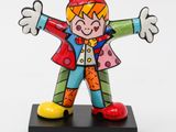 statue of a clown on a black base with a white background