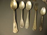 a lot of spoons and spoon spoons on the table