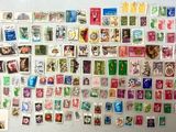 a large collection of stamps on the wall of a room