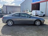 an image of a silver car parked in a parking lot