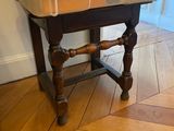 a small sink on a wooden table in a room