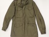 the jacket is green and has buttons on the collar