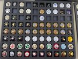 a display case with a lot of beer bottle caps in it