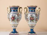 two vases that are sitting on a table