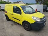 a yellow van that is parked in a parking lot