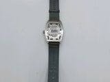 a watch that is sitting on a white surface