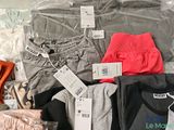 a pile of clothing that is sitting on a table
