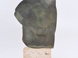 sculpture of a man ' s head on a wooden base
