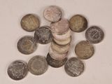 a pile of coins sitting on top of a white table
