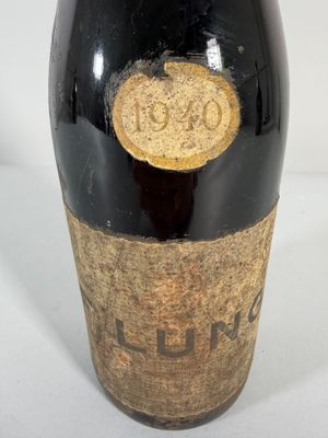 a bottle of wine that is sitting on a table