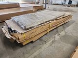 a large pile of cardboard sitting on the floor in a warehouse