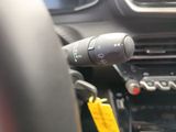 a close up of a steering control in a car