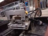 a machine that is sitting in the back of a truck