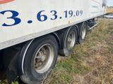a semi truck that is parked on the side of the road