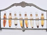 a metal rack with a lot of glass bottles on it