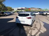 a white car that is parked in a parking lot