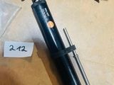 a vacuum that is sitting on the floor next to a box