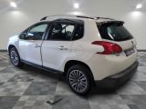 a picture of a white car parked in a garage