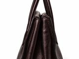 an image of a brown leather handbag on a white background