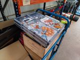 a cart full of books on the floor in a warehouse