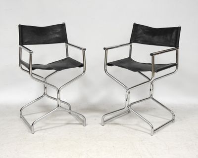 pair of chrome and black leather director ' s chairs