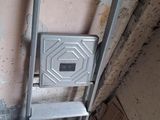 a ladder that is next to a wall in a room