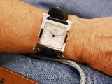 a person that is wearing a watch on his wrist