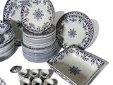 many different types of plates and bowls on the table